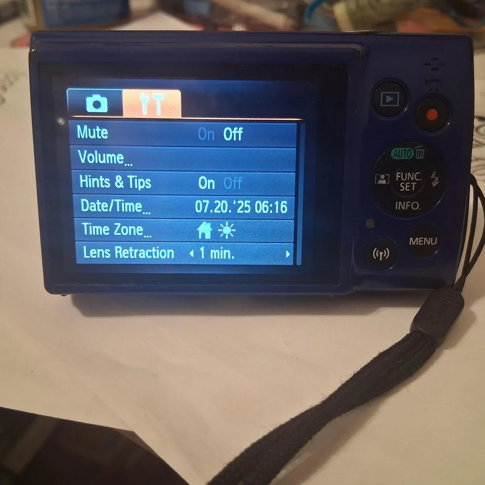 Canon Blue Digital Camera with Compact Design and Retractable Lens